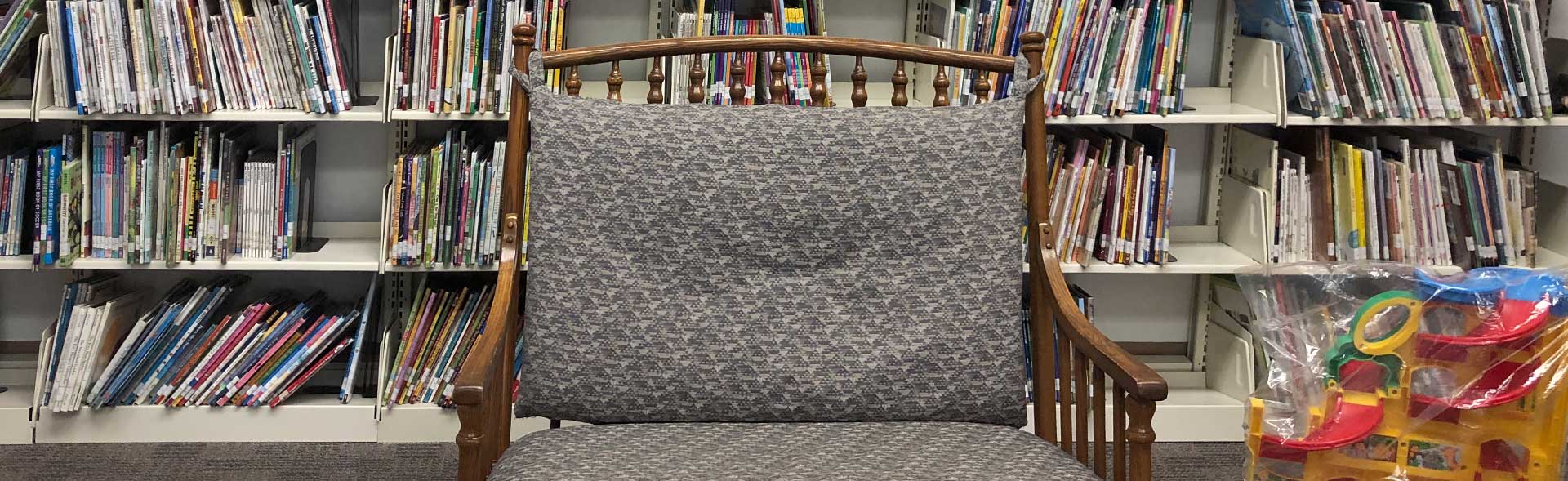 Beaverdale library has a red roof, door, and black shutters.